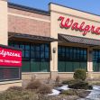 Exterior view of a Walgreens store with a drive-thru pharmacy sign. Exterior view of a Walgreens store with a drive-thru pharmacy sign.