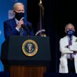President Biden speaking at a podium with the presidential seal, with Dr. Anthony Fauci visible in the background, both wearing masks. President Biden speaking at a podium with the presidential seal, with Dr. Anthony Fauci visible in the background, both wearing masks.
