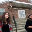 Two women stand outside Bangor Christian Schools, discussing in front of the entrance. Two women stand outside Bangor Christian Schools, discussing in front of the entrance.