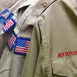 Uniforms of the Boy Scouts of America displaying American flag patches. Uniforms of the Boy Scouts of America displaying American flag patches.