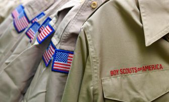 Uniforms of the Boy Scouts of America displaying American flag patches.