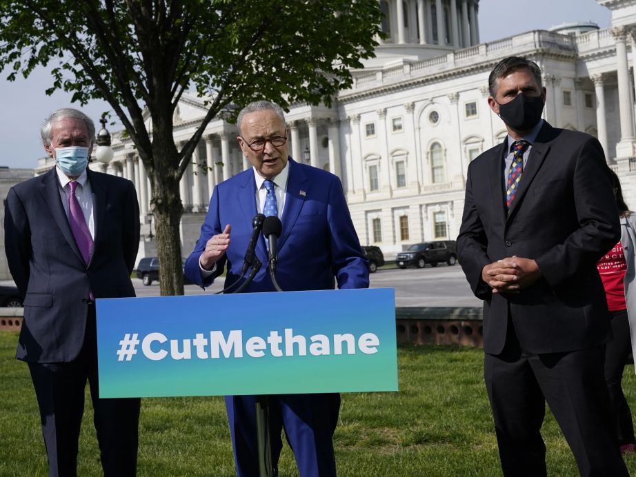 Senate Majority Leader Chuck Schumer, D-N.Y., joined by Sen. Ed Markey, D-Mass., left, and Sen. Martin Heinrich, D-N.M., talks about legislation to re-impose critical regulations to reduce methane pollution from oil and gas wells. (J. Scott Applewhite / AP)
