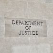 Sign on the building of the Department of Justice. Sign on the building of the Department of Justice.