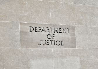 Sign on the building of the Department of Justice.