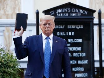 Former President Donald Trump holding a bible in front of St. John's Church, following the controversial clearing of protesters in Lafayette Square.