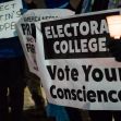 Protesters holding signs advocating for the Electoral College and urging people to vote their conscience. Protesters holding signs advocating for the Electoral College and urging people to vote their conscience.