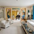 Interior view of Graceland, featuring a grand piano, decorative windows, and elegant furnishings. Interior view of Graceland, featuring a grand piano, decorative windows, and elegant furnishings.