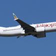 Ethiopian Airlines Boeing 737 MAX in flight against a clear blue sky. Ethiopian Airlines Boeing 737 MAX in flight against a clear blue sky.