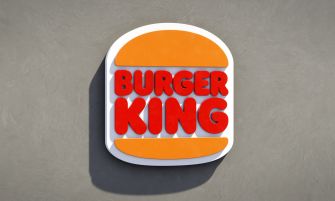 Logo of Burger King on a textured background.