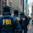 FBI agents in tactical gear standing in an urban setting. FBI agents in tactical gear standing in an urban setting.