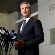 California Governor Gavin Newsom speaking at a press conference with multiple microphones in front of him. California Governor Gavin Newsom speaking at a press conference with multiple microphones in front of him.