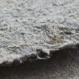Close-up view of asbestos fibers on a surface. Close-up view of asbestos fibers on a surface.