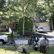 A scene outside a home with news cameras set up, following a violent incident involving a judge's family. A scene outside a home with news cameras set up, following a violent incident involving a judge's family.