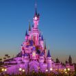 Disneyland's iconic castle illuminated at dusk. Disneyland's iconic castle illuminated at dusk.