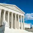 Exterior view of the United States Supreme Court building under a blue sky with clouds. Exterior view of the United States Supreme Court building under a blue sky with clouds.