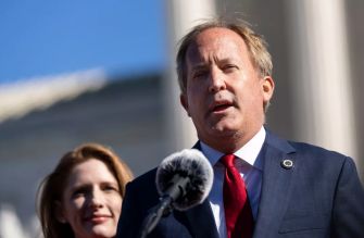 Texas Attorney General Ken Paxton speaking at a press conference, addressing the lawsuit against a New York doctor for providing abortion services via telehealth.