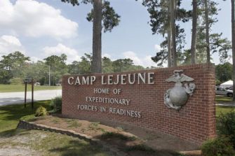 Sign for Camp Lejeune, a U.S. Marine Corps base in North Carolina, highlighting its role as a home for expeditionary forces.
