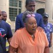 Family members of a woman who was fatally shot during a police search warrant gather outside a courthouse, expressing their grief and calls for justice. Family members of a woman who was fatally shot during a police search warrant gather outside a courthouse, expressing their grief and calls for justice.