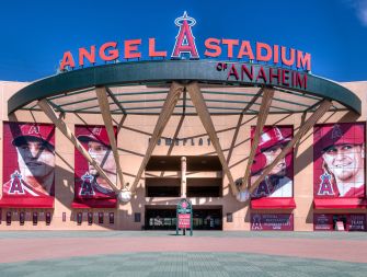 Entrance of Angel Stadium in Anaheim, featuring large banners of players and the team's logo.