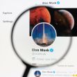 Elon Musk's Twitter profile page displayed on a computer screen, magnified through a lens. Elon Musk's Twitter profile page displayed on a computer screen, magnified through a lens.