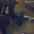 Body camera footage shows police officers restraining an unarmed man on the ground during a violent encounter. Body camera footage shows police officers restraining an unarmed man on the ground during a violent encounter.