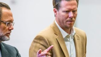 Paul Petersen, a former Arizona official, appears in court during his sentencing for running an illegal adoption scheme.