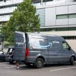 An Amazon Prime delivery van is being unloaded on the streets in downtown Portland, Oregon.