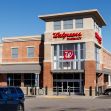 Walgreens pharmacy building with a parking lot visible in front. Walgreens pharmacy building with a parking lot visible in front.