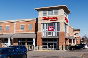 Walgreens pharmacy building with a parking lot visible in front.