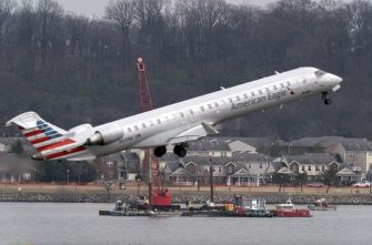American Eagle aircraft taking off over the Potomac River, near Washington, D.C.
