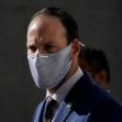 Former San Francisco Police Officer Chris Samayoa, charged with manslaughter, wearing a mask and formal attire. Former San Francisco Police Officer Chris Samayoa, charged with manslaughter, wearing a mask and formal attire.