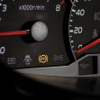 Image of a car dashboard showing illuminated indicators, including the ABS warning light. Image of a car dashboard showing illuminated indicators, including the ABS warning light.