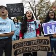 A group of diverse protesters holding signs in support of affirmative action and diversity in college admissions. A group of diverse protesters holding signs in support of affirmative action and diversity in college admissions.
