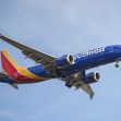 Southwest Airlines aircraft in flight against a blue sky. Southwest Airlines aircraft in flight against a blue sky.