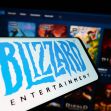 Logo of Blizzard Entertainment displayed on a smartphone with a blurred background of game titles. Logo of Blizzard Entertainment displayed on a smartphone with a blurred background of game titles.