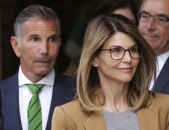 Mossimo Giannulli and Lori Loughlin leaving a courthouse amid the college admissions scandal.