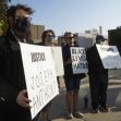Protestors holding signs demanding justice for victims of gun violence, including Joseph Rosenbaum and Anthony Huber, at a demonstration related to the Rittenhouse case. Protestors holding signs demanding justice for victims of gun violence, including Joseph Rosenbaum and Anthony Huber, at a demonstration related to the Rittenhouse case.