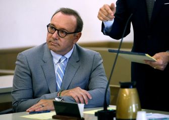 Kevin Spacey in a courtroom during a legal proceeding related to sexual assault allegations.