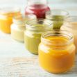 Assorted jars of baby food in various colors and textures. Assorted jars of baby food in various colors and textures.