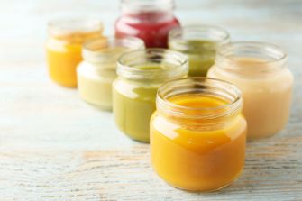 Assorted jars of baby food in various colors and textures.