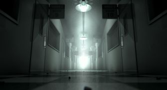 A dimly lit hallway in a mental health facility with room numbers visible on the doors.