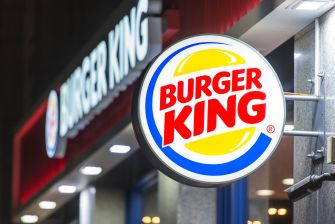 Signage of a Burger King restaurant at night.