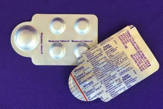 Image of a blister pack containing Mifepristone and Misoprostol tablets, commonly used for medical abortions.