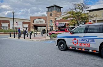 Emergency services vehicle in front of Park City Center Mall following the October 2021 shooting incident.