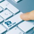 A finger pressing a keyboard key labeled "Fair Use" with an icon symbolizing copyright. A finger pressing a keyboard key labeled "Fair Use" with an icon symbolizing copyright.