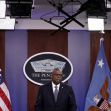 Defense Secretary Lloyd J. Austin III speaks at a podium with the Pentagon logo, flanked by the American flag and an Air Force flag. Defense Secretary Lloyd J. Austin III speaks at a podium with the Pentagon logo, flanked by the American flag and an Air Force flag.