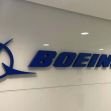 Boeing company logo displayed on a wall. Boeing company logo displayed on a wall.