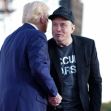 Elon Musk and Donald Trump shake hands on stage during an event. Elon Musk and Donald Trump shake hands on stage during an event.