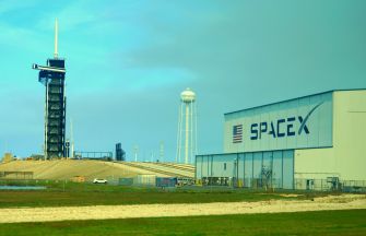 SpaceX launch facility at Boca Chica, Texas, featuring the launch tower and facility building.