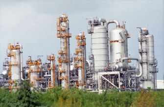 Industrial facility with pipes and towers, associated with Formosa Plastics Corp. in Texas.